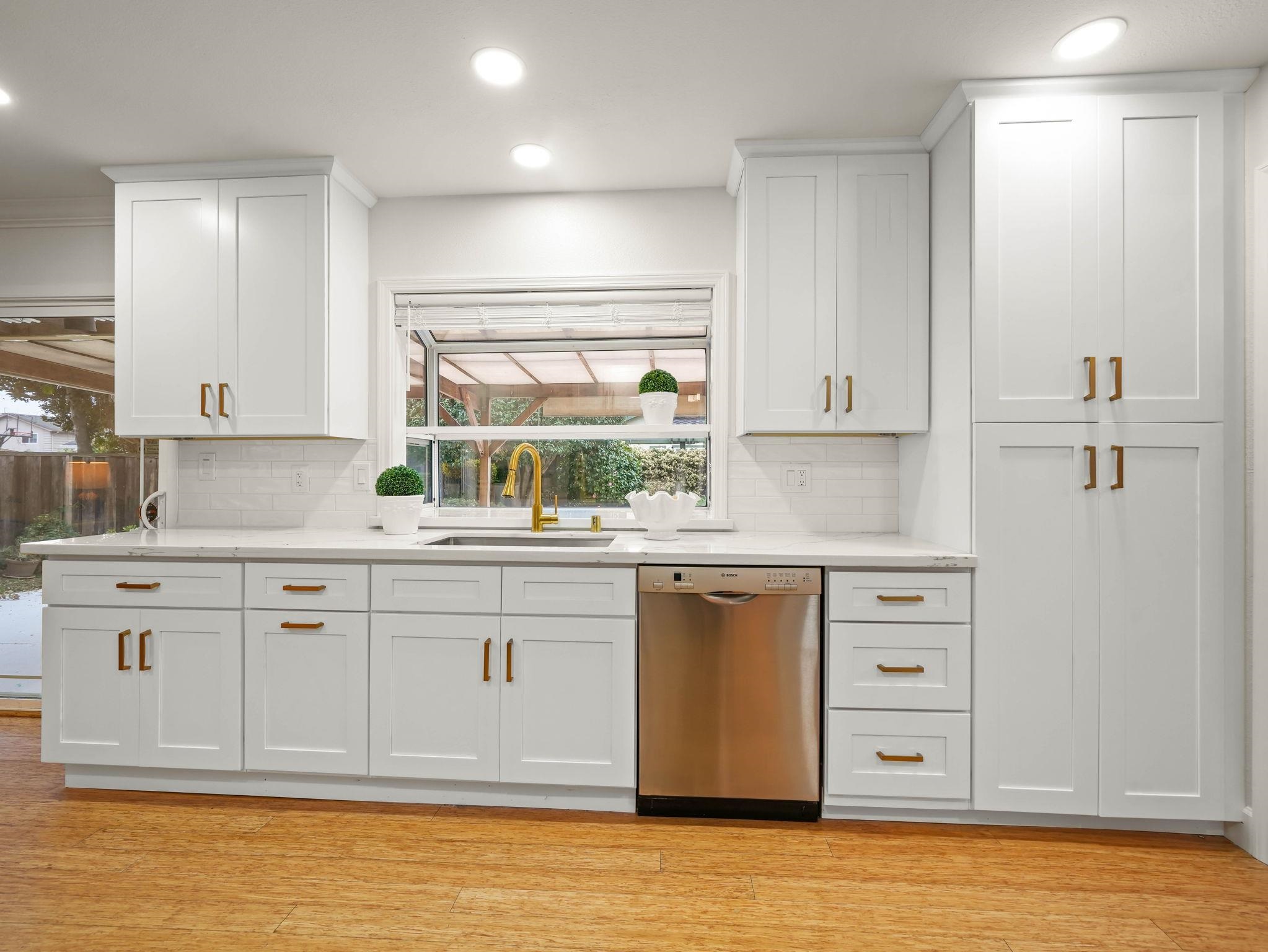 3433 Surry Place Fremont, CA 94536 - Photo 16 of 53 a kitchen with granite countertop white cabinets and white appliances