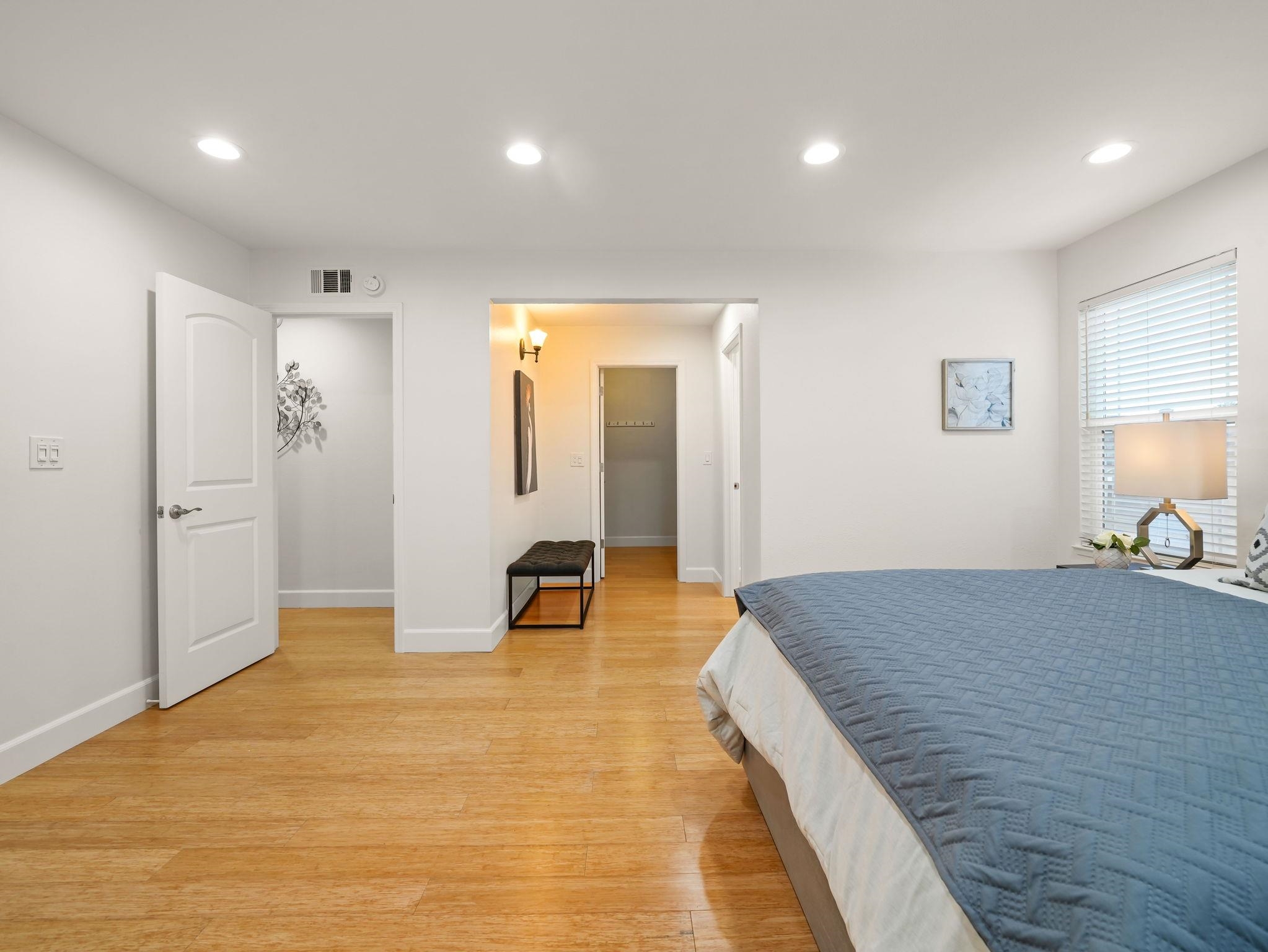 3433 Surry Place Fremont, CA 94536 - Photo 25 of 53 a spacious bedroom with a bed and a table in it