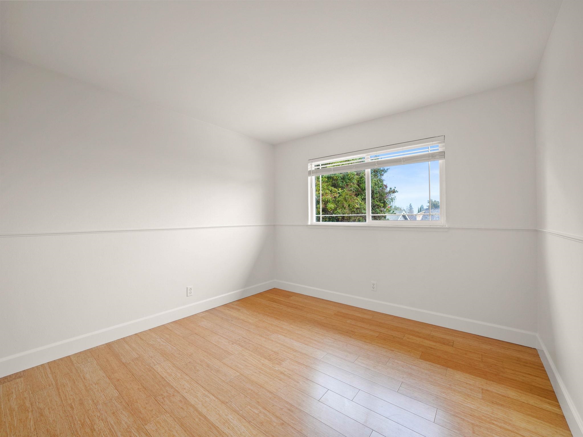 3433 Surry Place Fremont, CA 94536 - Photo 39 of 53 an empty room with wooden floor and windows