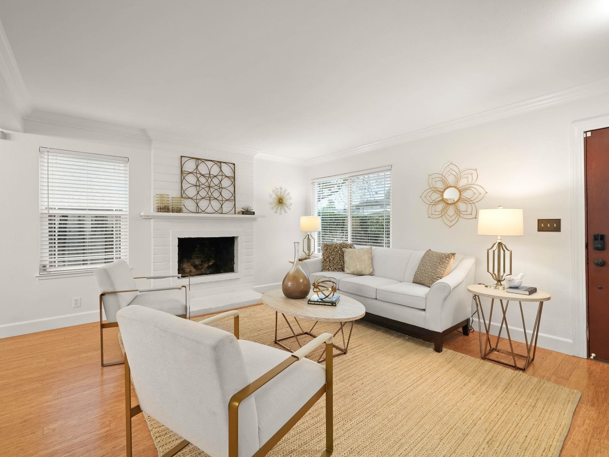 3433 Surry Place Fremont, CA 94536 - Photo 4 of 53 a living room with furniture a fireplace and a table
