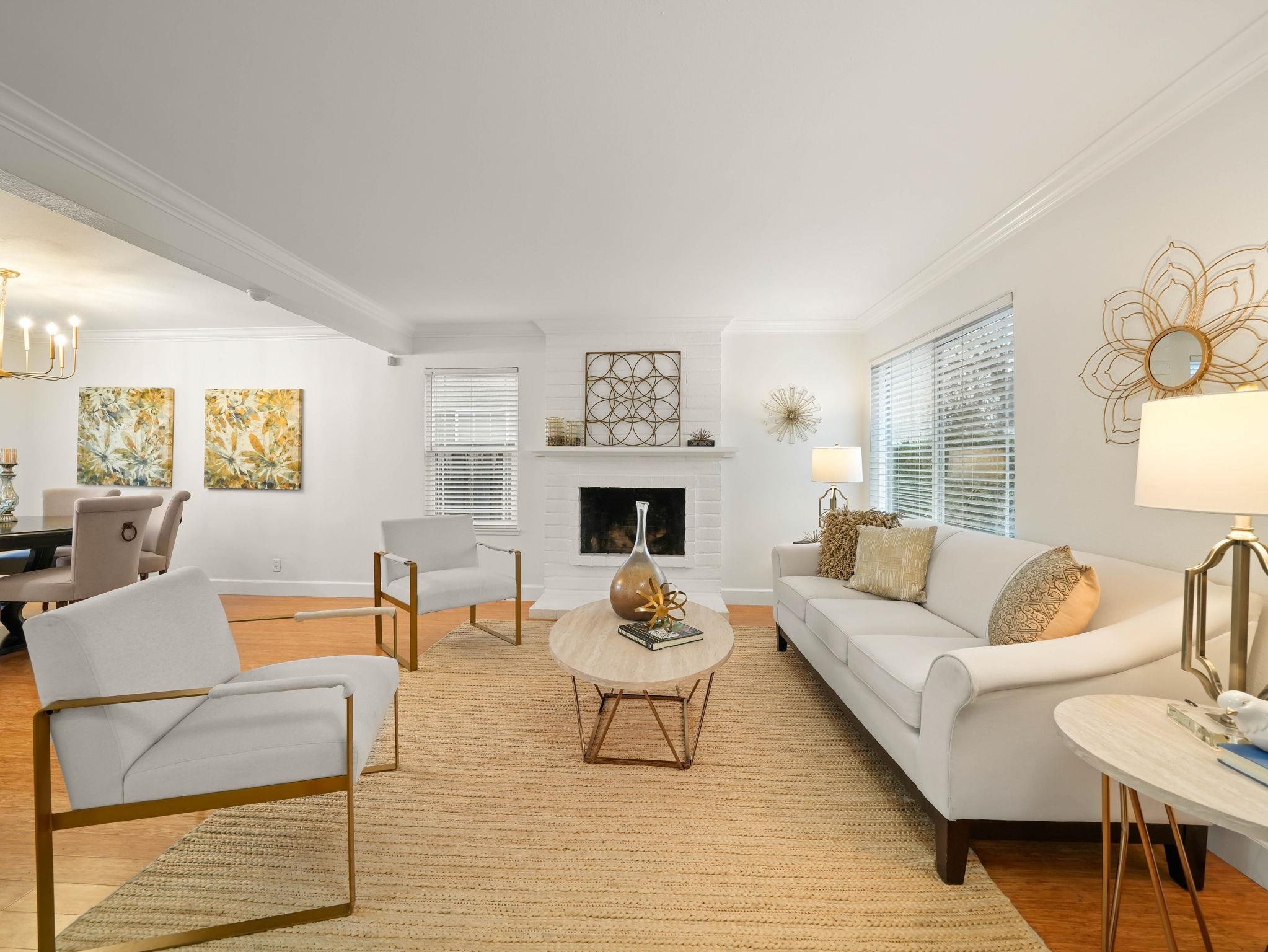 3433 Surry Place Fremont, CA 94536 - Photo 9 of 53 a living room with furniture a fireplace and a table
