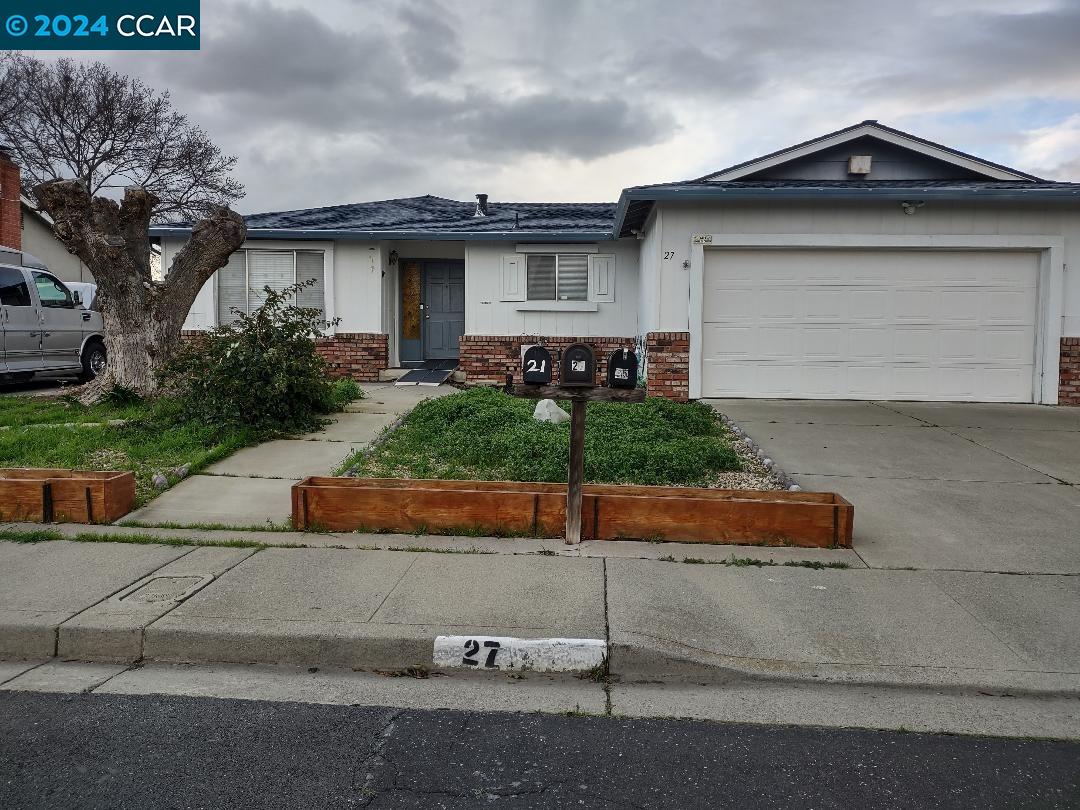 a front view of a house with garage