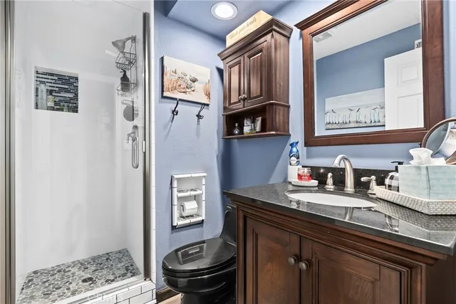 a kitchen with stainless steel appliances granite countertop a sink stove and cabinets