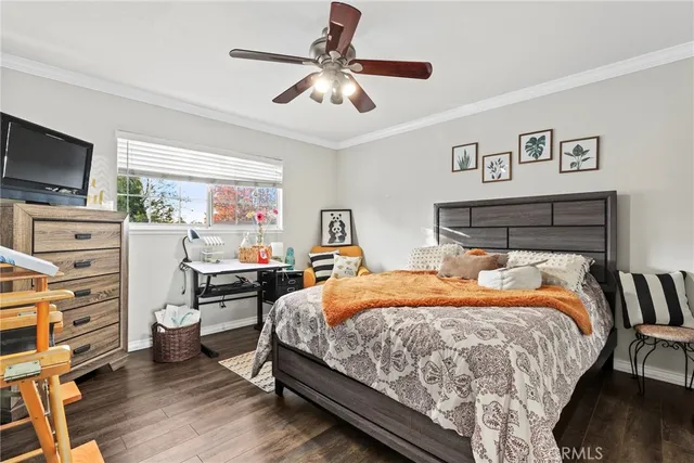 a bedroom with a bed and a chair