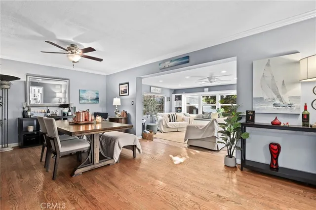 a living room with furniture a rug and white walls