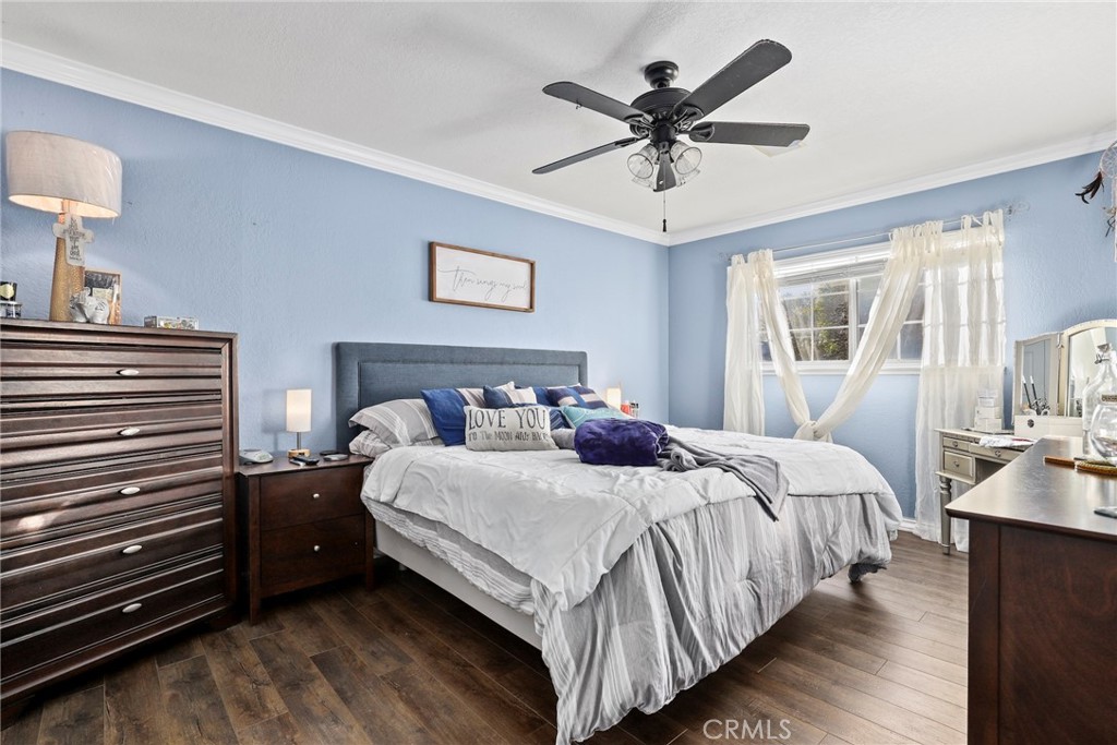 1369 Friant Avenue Simi Valley, CA 93065 - Photo 22 of 38 a bedroom with bed and a chandelier