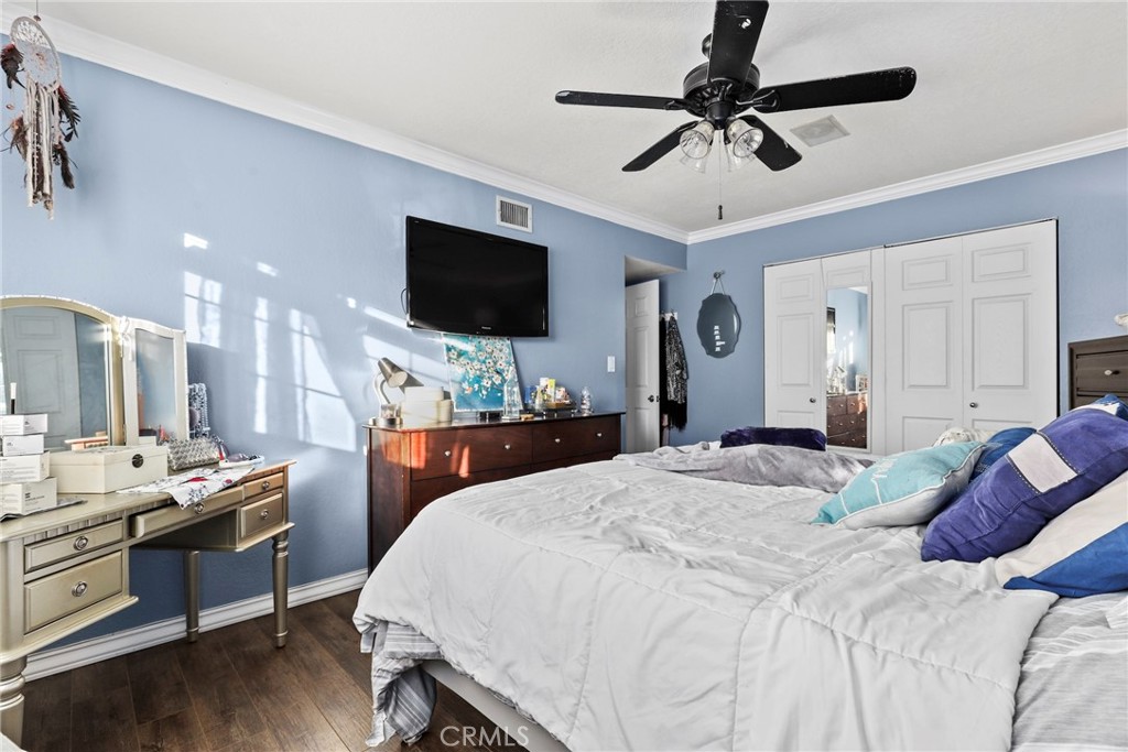 1369 Friant Avenue Simi Valley, CA 93065 - Photo 23 of 38 a bedroom with a bed and a flat screen tv