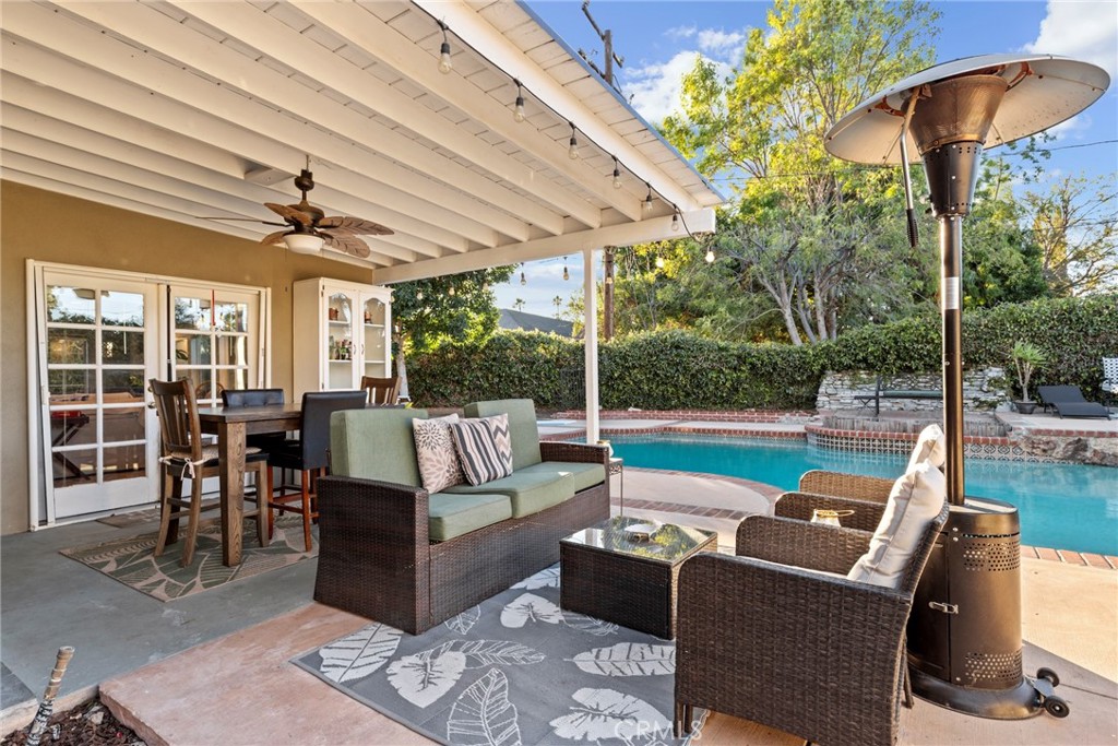 1369 Friant Avenue Simi Valley, CA 93065 - Photo 30 of 38 a view of a patio with couches chairs dining table and chairs