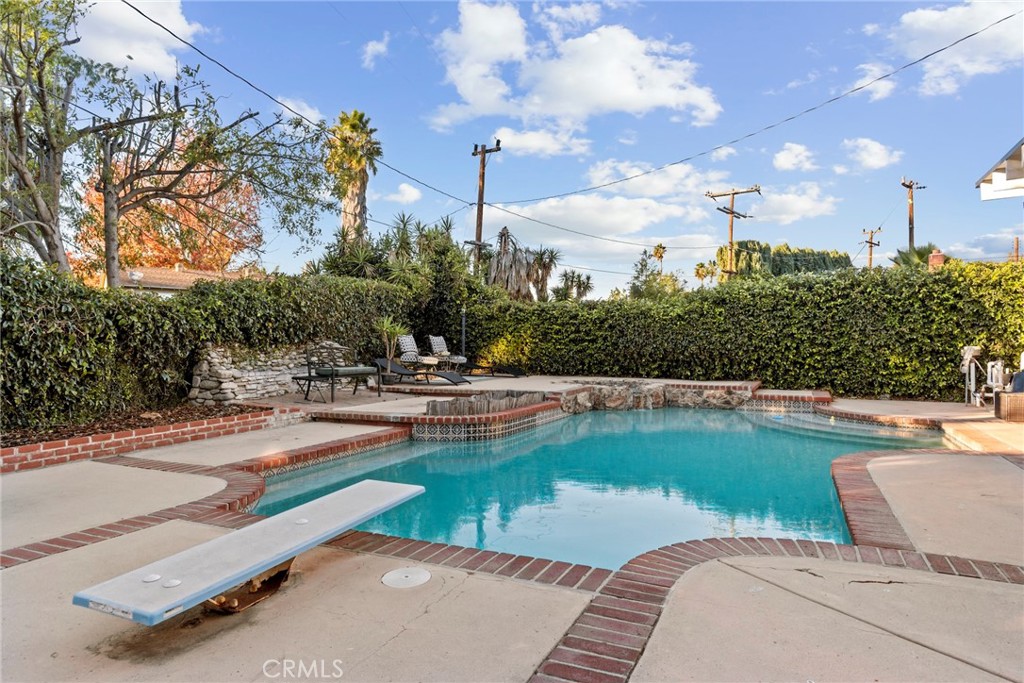 1369 Friant Avenue Simi Valley, CA 93065 - Photo 31 of 38 a view of a swimming pool and lounge chairs