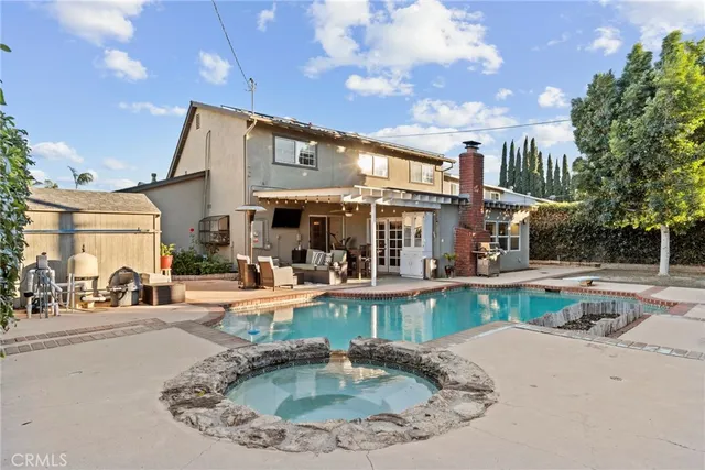 a view of a swimming pool with a patio