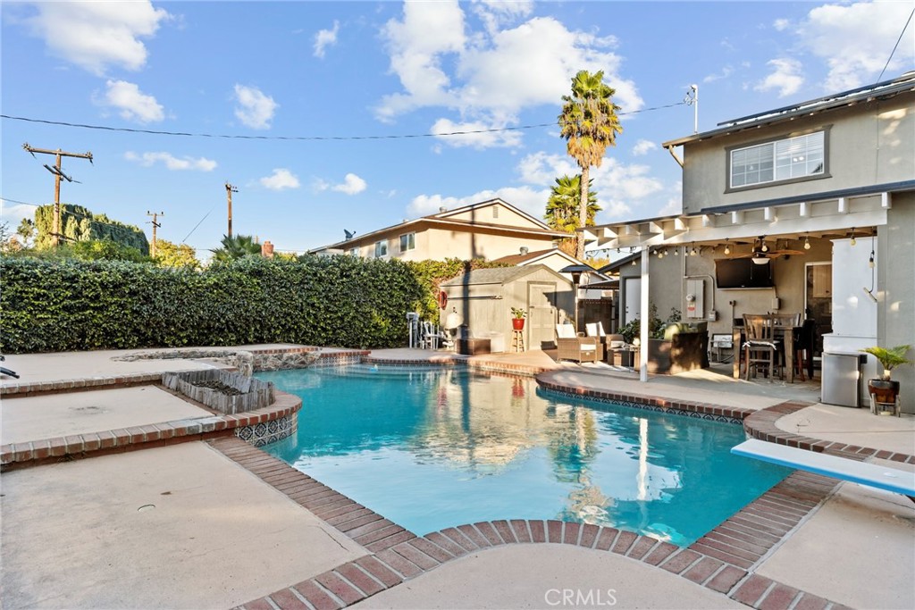 1369 Friant Avenue Simi Valley, CA 93065 - Photo 34 of 38 a view of a swimming pool with outdoor seating