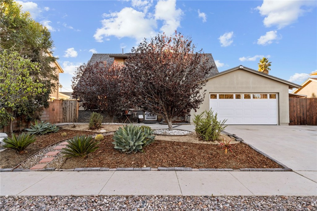 1369 Friant Avenue Simi Valley, CA 93065 - Photo 35 of 38 a front view of a house with a yard and garage