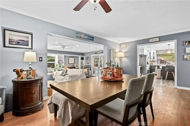 a dining room with furniture and wooden floor