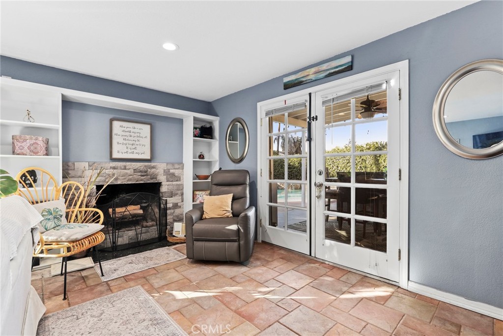 1369 Friant Avenue Simi Valley, CA 93065 - Photo 7 of 38 a living room with furniture a window and a fireplace
