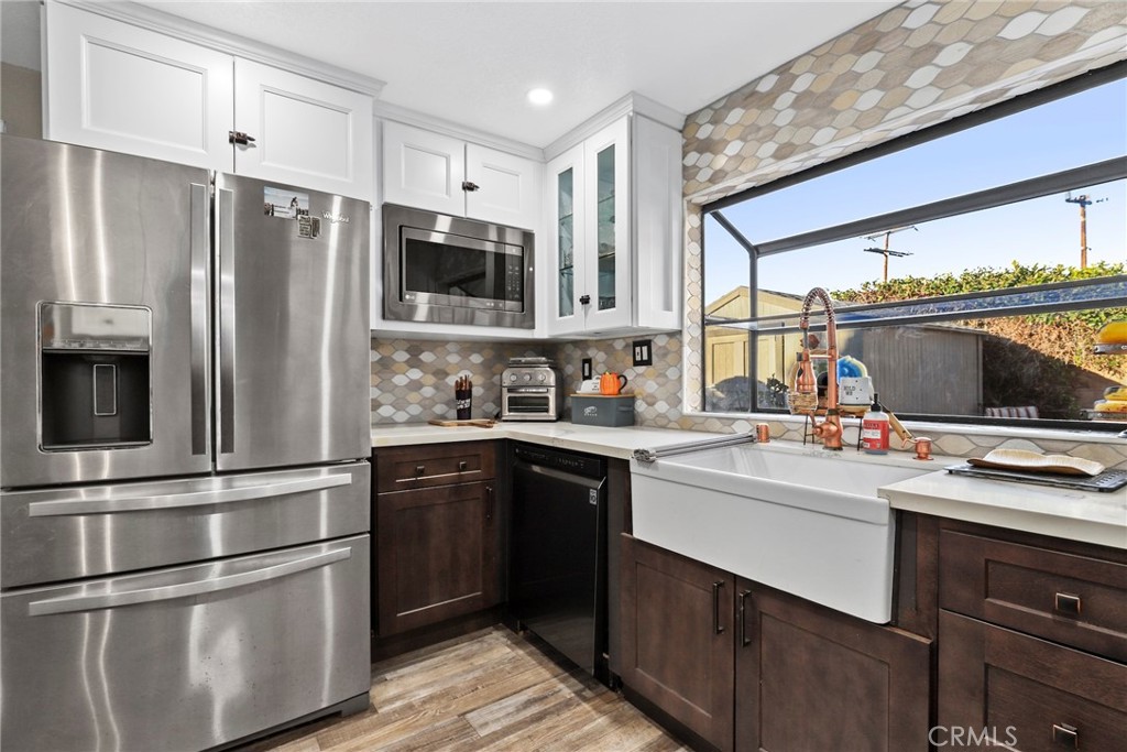1369 Friant Avenue Simi Valley, CA 93065 - Photo 10 of 38 a kitchen with a refrigerator and a sink