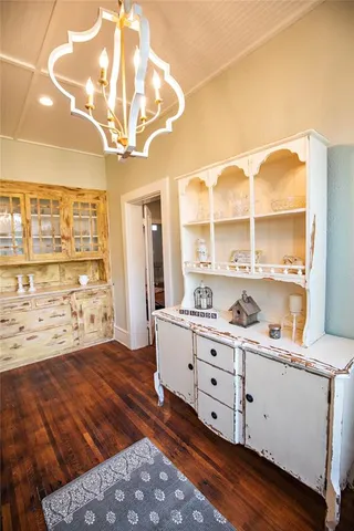 a view of walk in closet with wooden floor