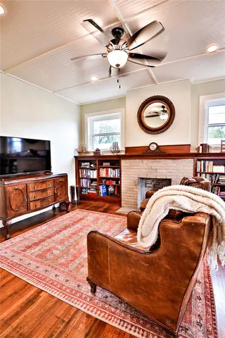 a view of an entryway with wooden floor and stairs
