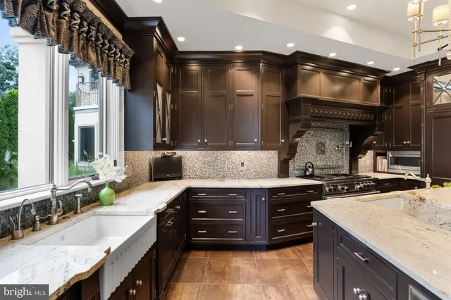 a stove top oven sitting inside of a kitchen