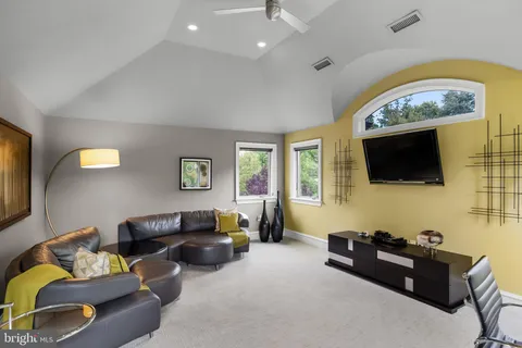 a view of a hallway with closet and stairs