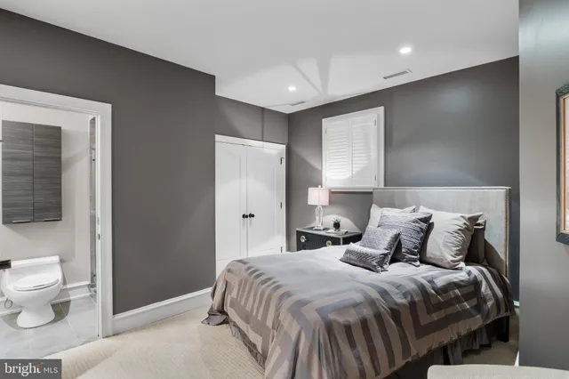 a view of a patio with couches table and chairs and potted plants
