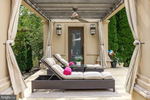 a view of an outside dining space with furniture