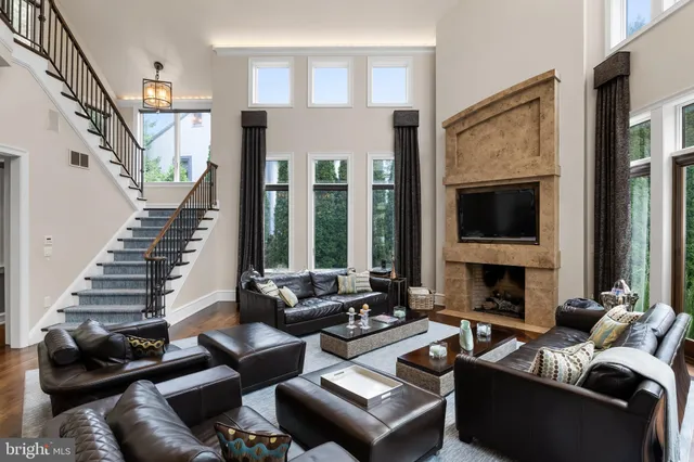 a living room with furniture fireplace and flat screen tv