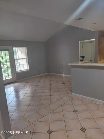 a view of an empty room and window