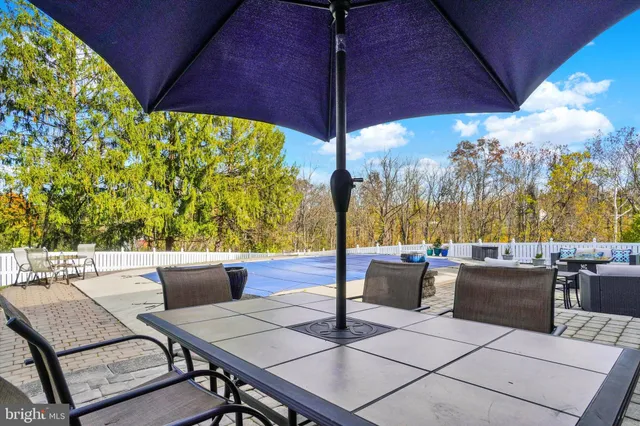 a view of an outdoor dining space with a patio