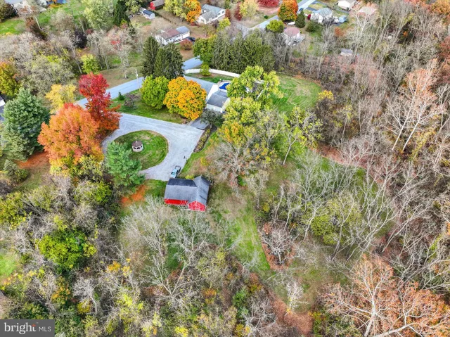 an aerial view of a house with a garden