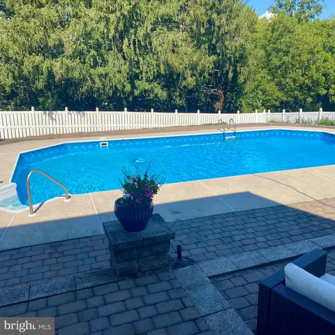 a view of a swimming pool with a patio