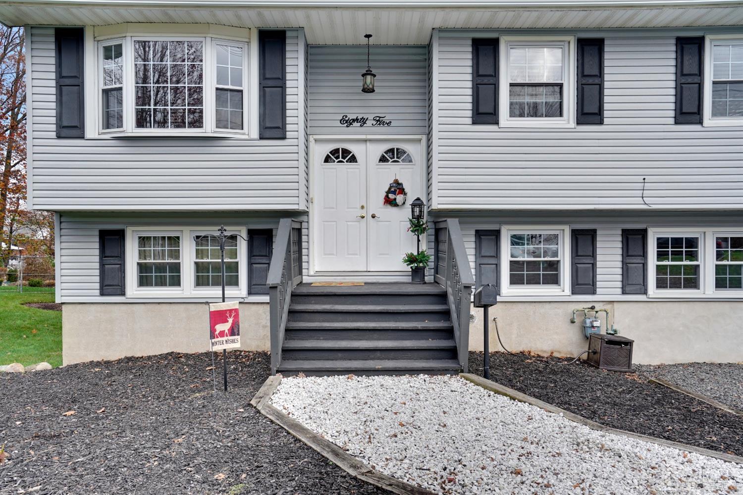 85 Old Post Road Edison, NJ 08817 - Photo 2 of 35 a front view of a house with a yard