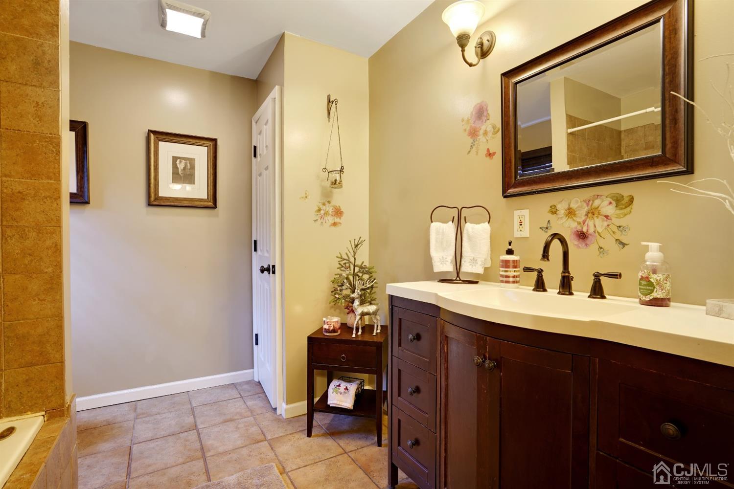 85 Old Post Road Edison, NJ 08817 - Photo 16 of 35 a bathroom with a sink and a mirror