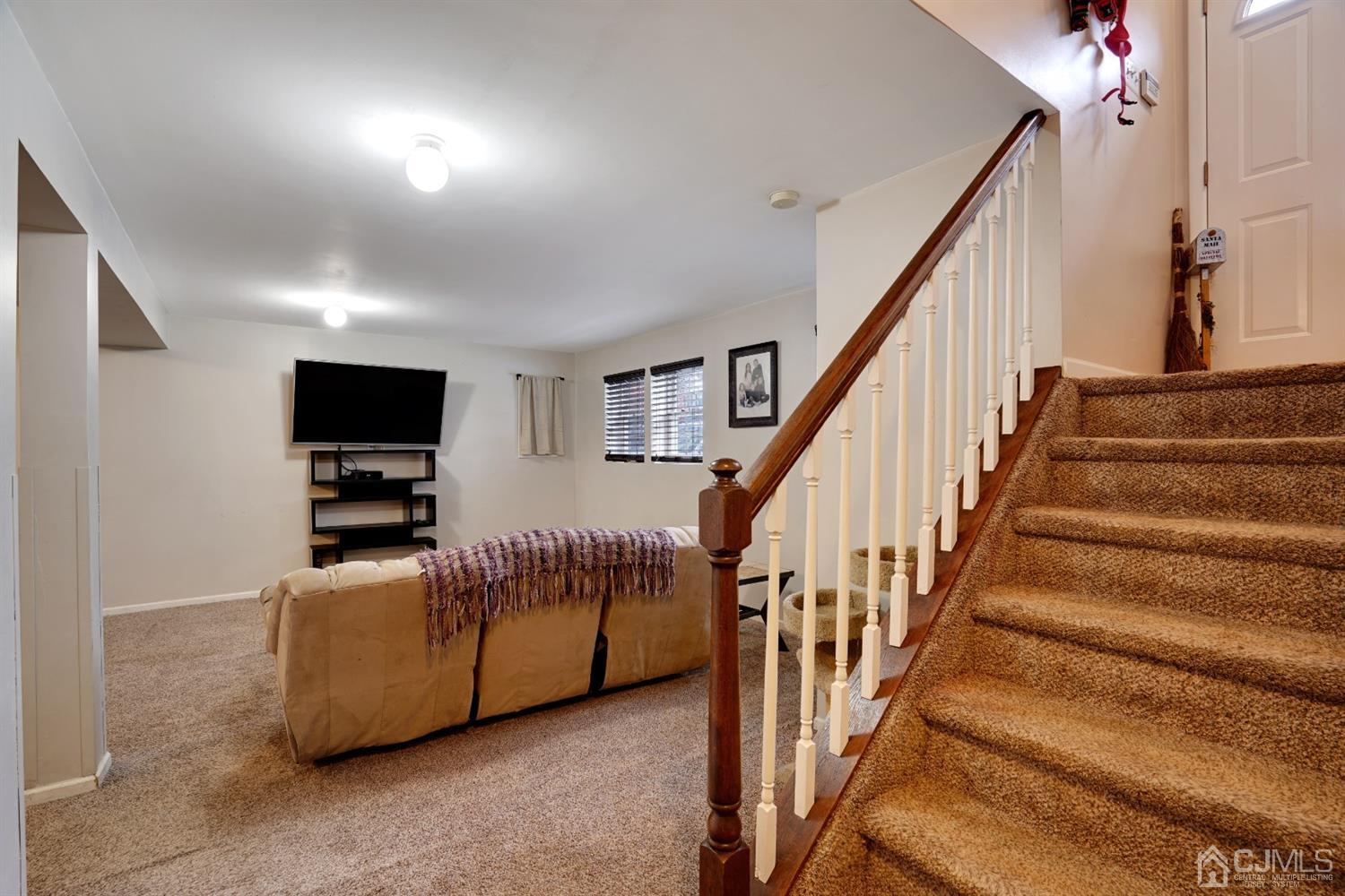85 Old Post Road Edison, NJ 08817 - Photo 19 of 35 a living room with furniture and a flat screen tv