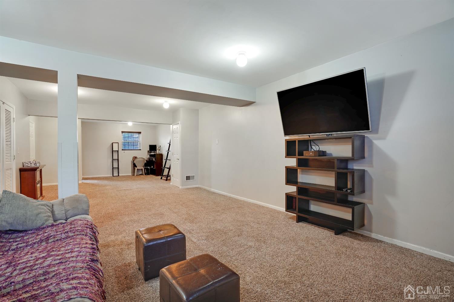85 Old Post Road Edison, NJ 08817 - Photo 21 of 35 a living room with furniture and a flat screen tv