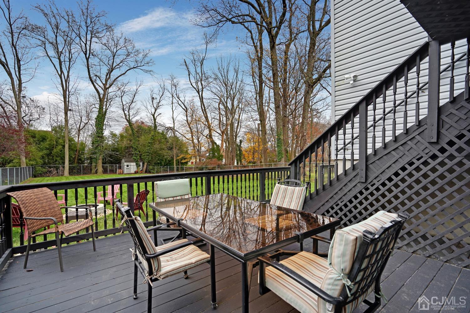 85 Old Post Road Edison, NJ 08817 - Photo 31 of 35 a view of a balcony with wooden chairs and wooden floor