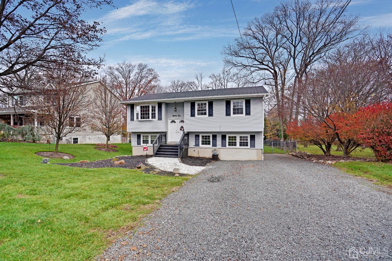 85 Old Post Road Edison, NJ 08817 - Photo 35 of 35 a view of a house with a big yard and large trees