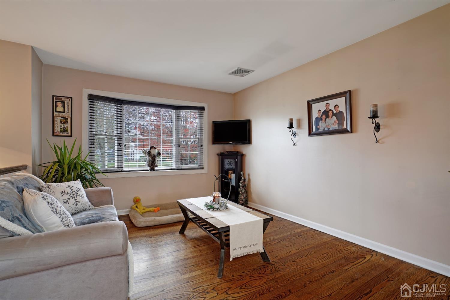 85 Old Post Road Edison, NJ 08817 - Photo 5 of 35 a living room with furniture and a flat screen tv