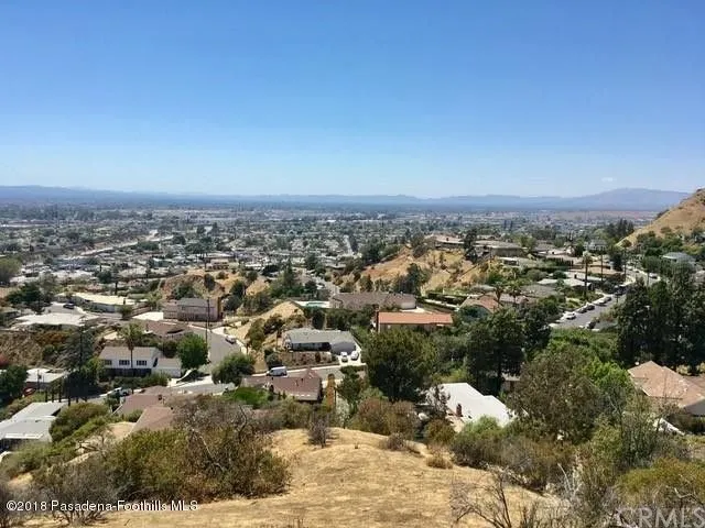 a view of a yard covered in snow