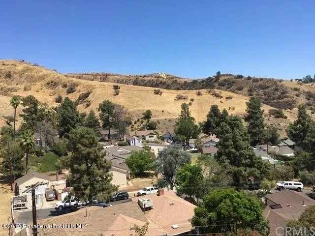 a view of outdoor space and a yard