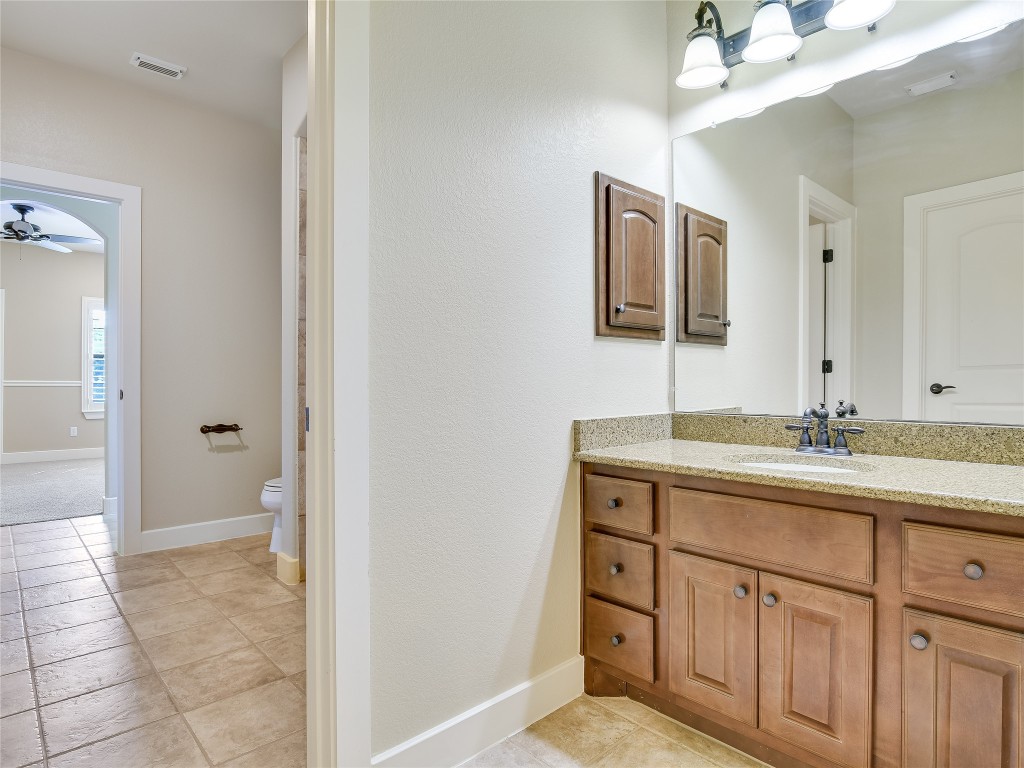 1036 Liberty Park Drive, Unit 54 Austin, TX 78746 - Photo 21 of 24 a bathroom with a sink and a mirror