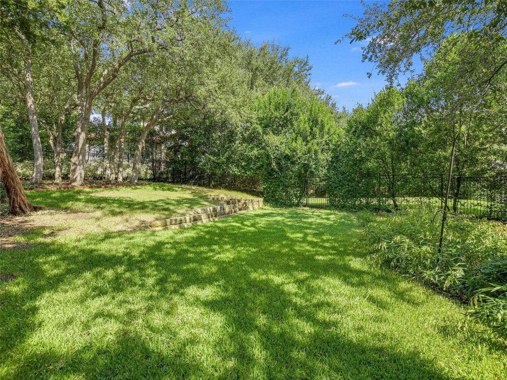 1036 Liberty Park Drive, Unit 54 Austin, TX 78746 - Photo 23 of 24 a view of outdoor space with deck and yard