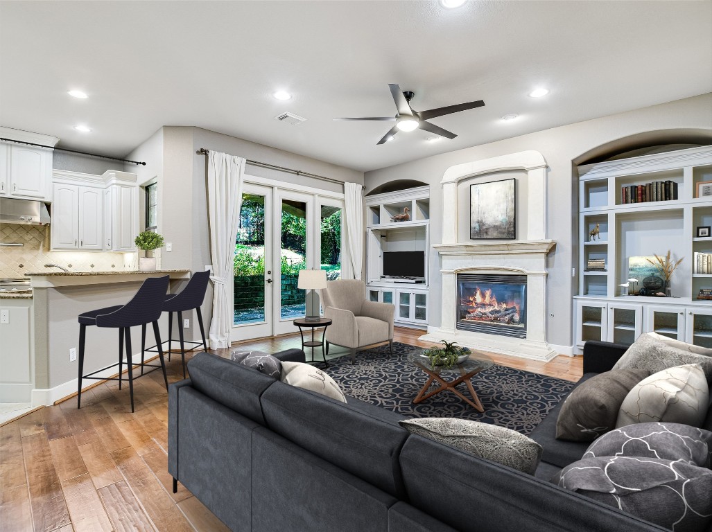 1036 Liberty Park Drive, Unit 54 Austin, TX 78746 - Photo 8 of 24 a living room with furniture and a fireplace