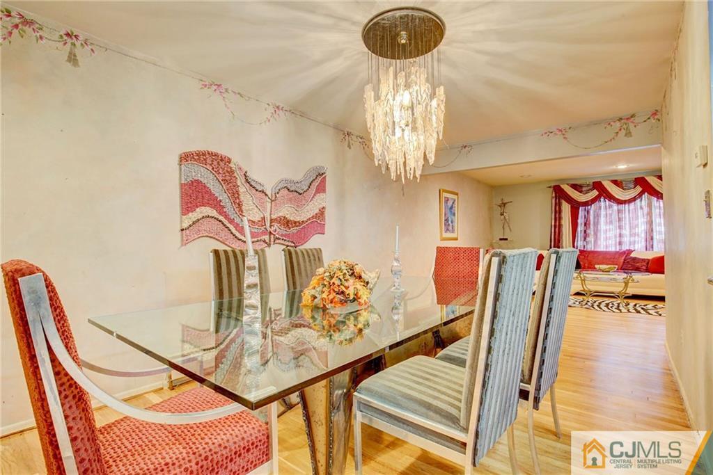 3 Pendleton Place Edison, NJ 08820 - Photo 12 of 47 a view of a room with furniture and a chandelier