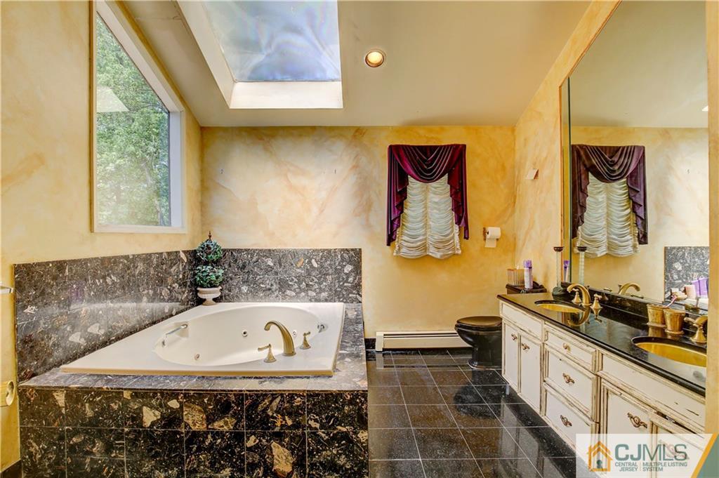 3 Pendleton Place Edison, NJ 08820 - Photo 24 of 47 a bathroom with a bathtub sink and mirror