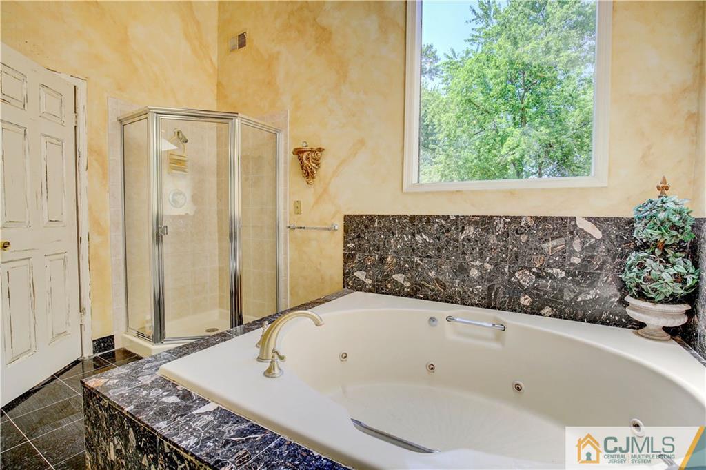 3 Pendleton Place Edison, NJ 08820 - Photo 25 of 47 a bathroom with a bathtub and shower