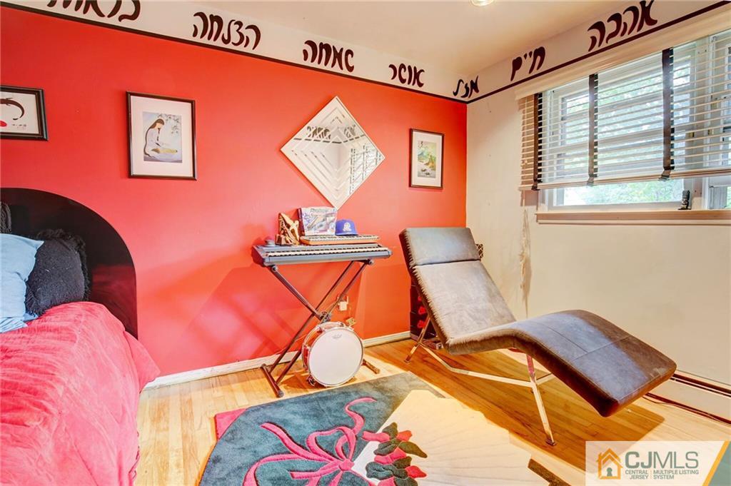 3 Pendleton Place Edison, NJ 08820 - Photo 28 of 47 a room with furniture and a lamp