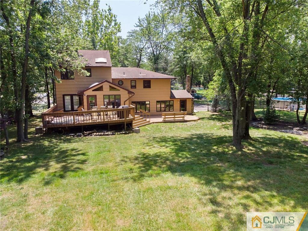 3 Pendleton Place Edison, NJ 08820 - Photo 40 of 47 a front view of a house with a yard table and chairs