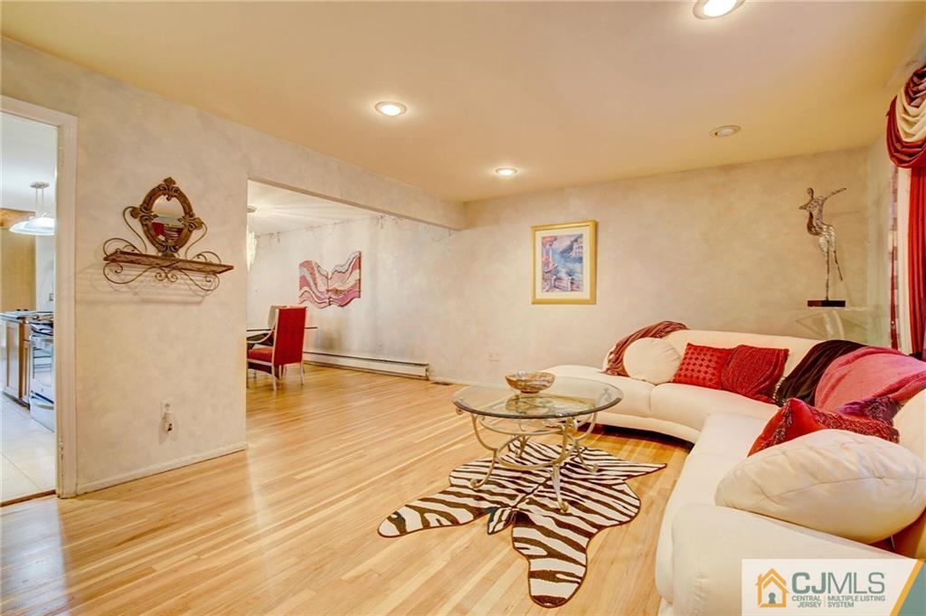 3 Pendleton Place Edison, NJ 08820 - Photo 6 of 47 a living room with furniture and a wooden floor