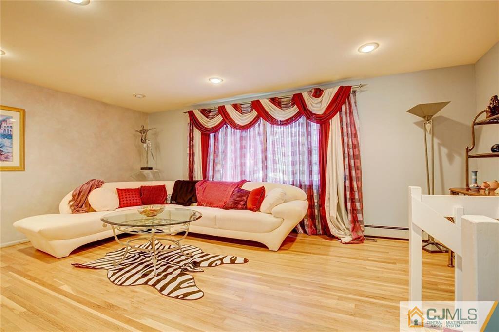 3 Pendleton Place Edison, NJ 08820 - Photo 7 of 47 a living room with furniture and a wooden floor