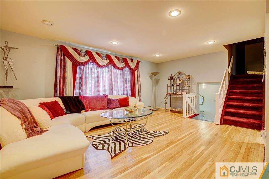 3 Pendleton Place Edison, NJ 08820 - Photo 8 of 47 a living room with furniture and wooden floor